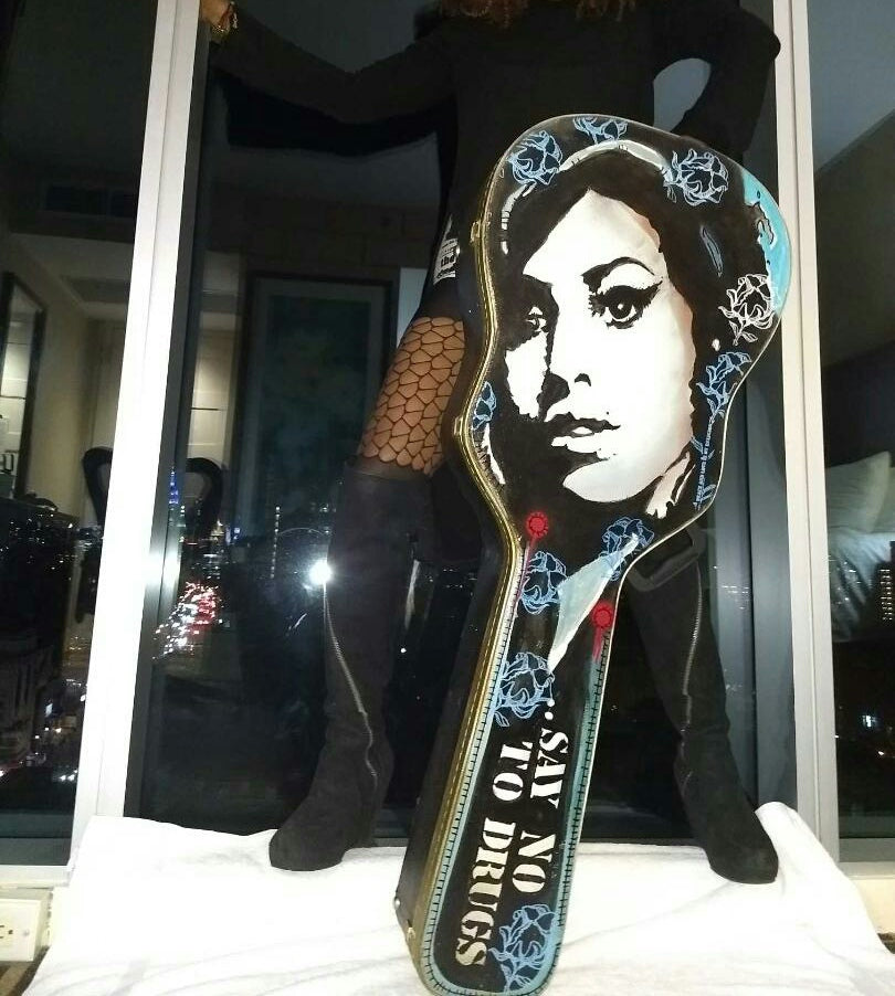 Amy winehouse painted on guitar case by Eric Lavazzon