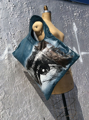 Asymmetrical leather Large Shoulder bag.  Sale…Blue leather . Eye symbol