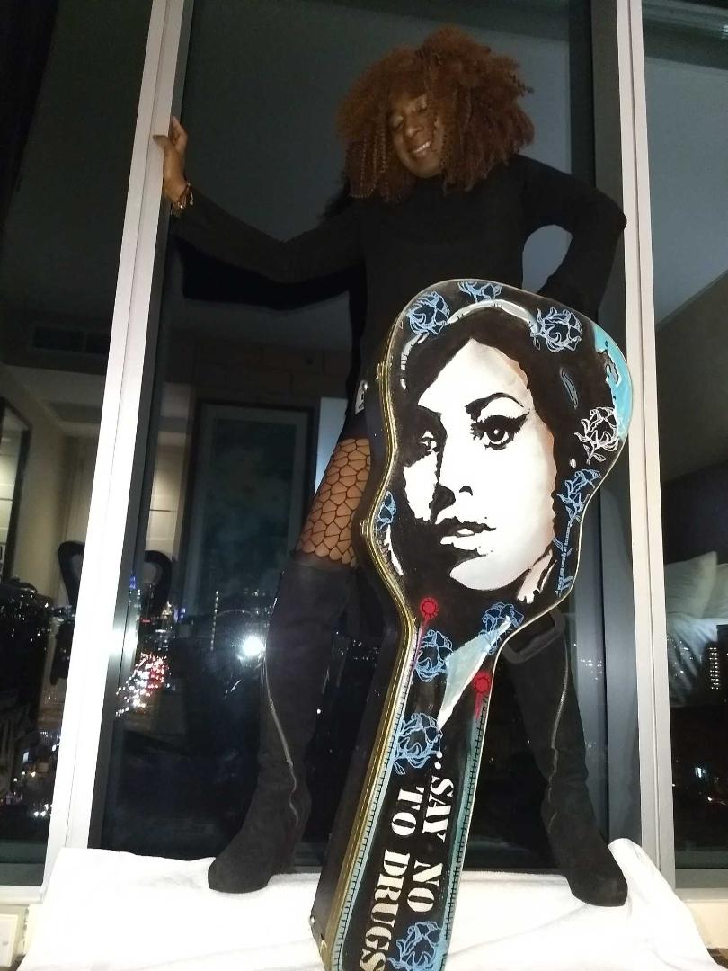 Amy winehouse painted on guitar case by Eric Lavazzon