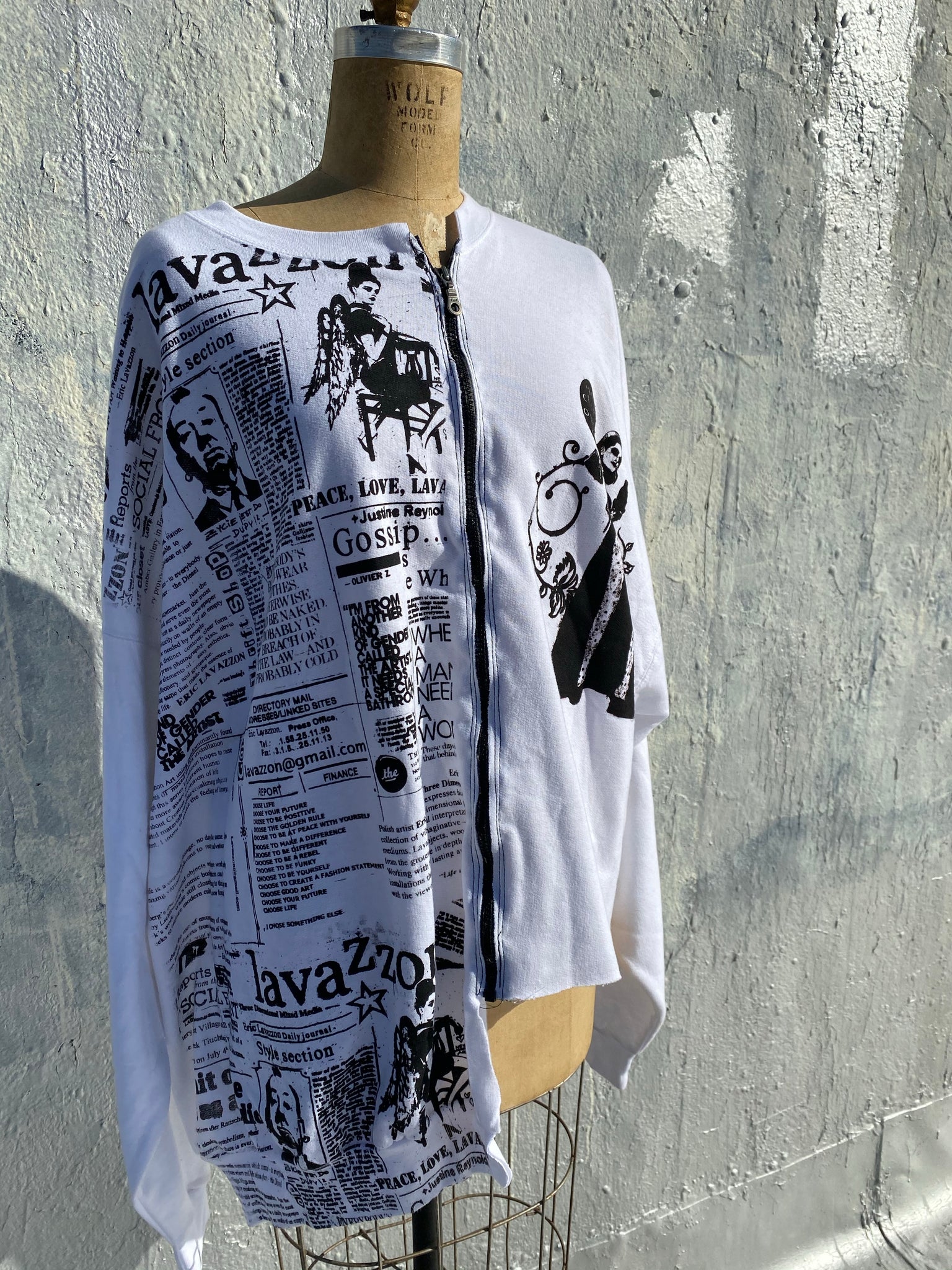 Lavazzon Asymmetrical zippered sweatshirt newsprint. Good clothes open all doors. One size