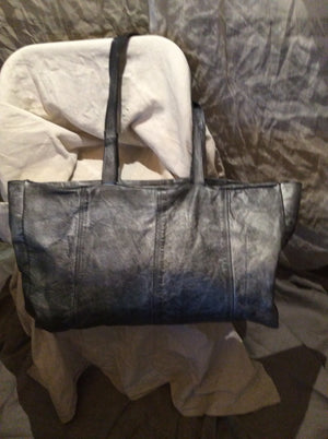Silver Travel leather statement Duffle bag.