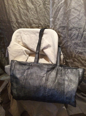 Silver Travel leather statement Duffle bag.