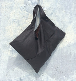 Asymmetrical leather bag solid black or with eye print